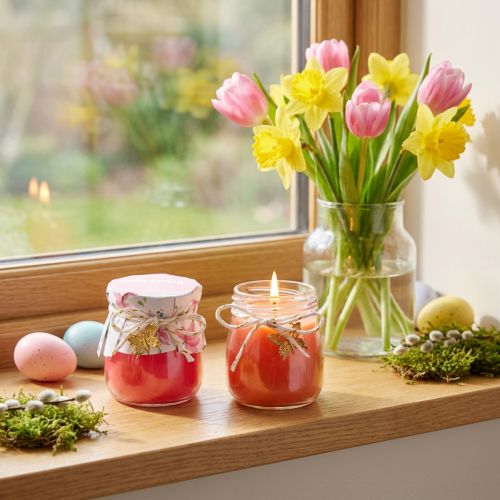Artikel Duftkerzen im Glas mit Schmetterlingsanhänger, Glas H7 cm, Orange und Pink