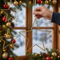 Glitzernde goldene Dekosterne