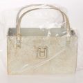 Goldfarbene Metalltasche